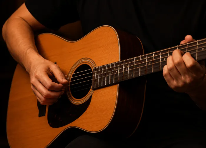 Aluna tocando violão